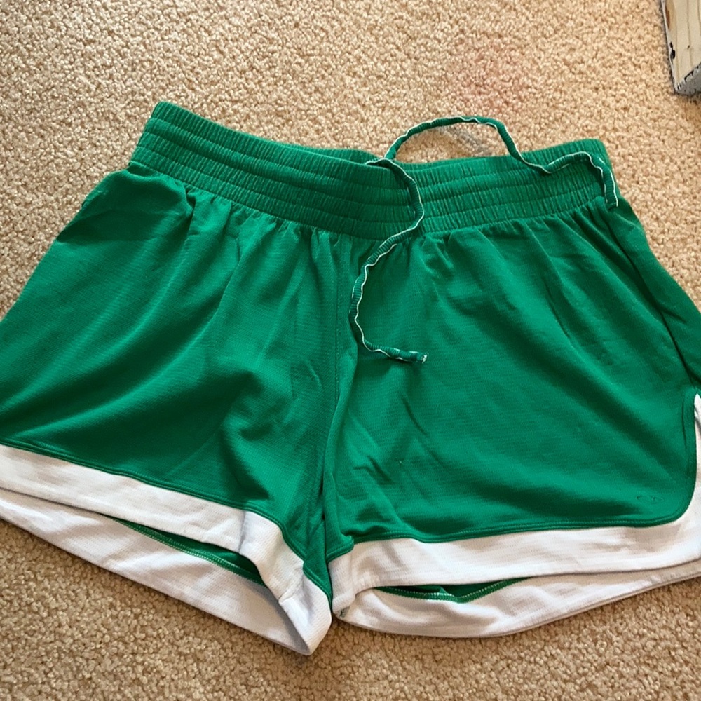 Green shorts with white trim